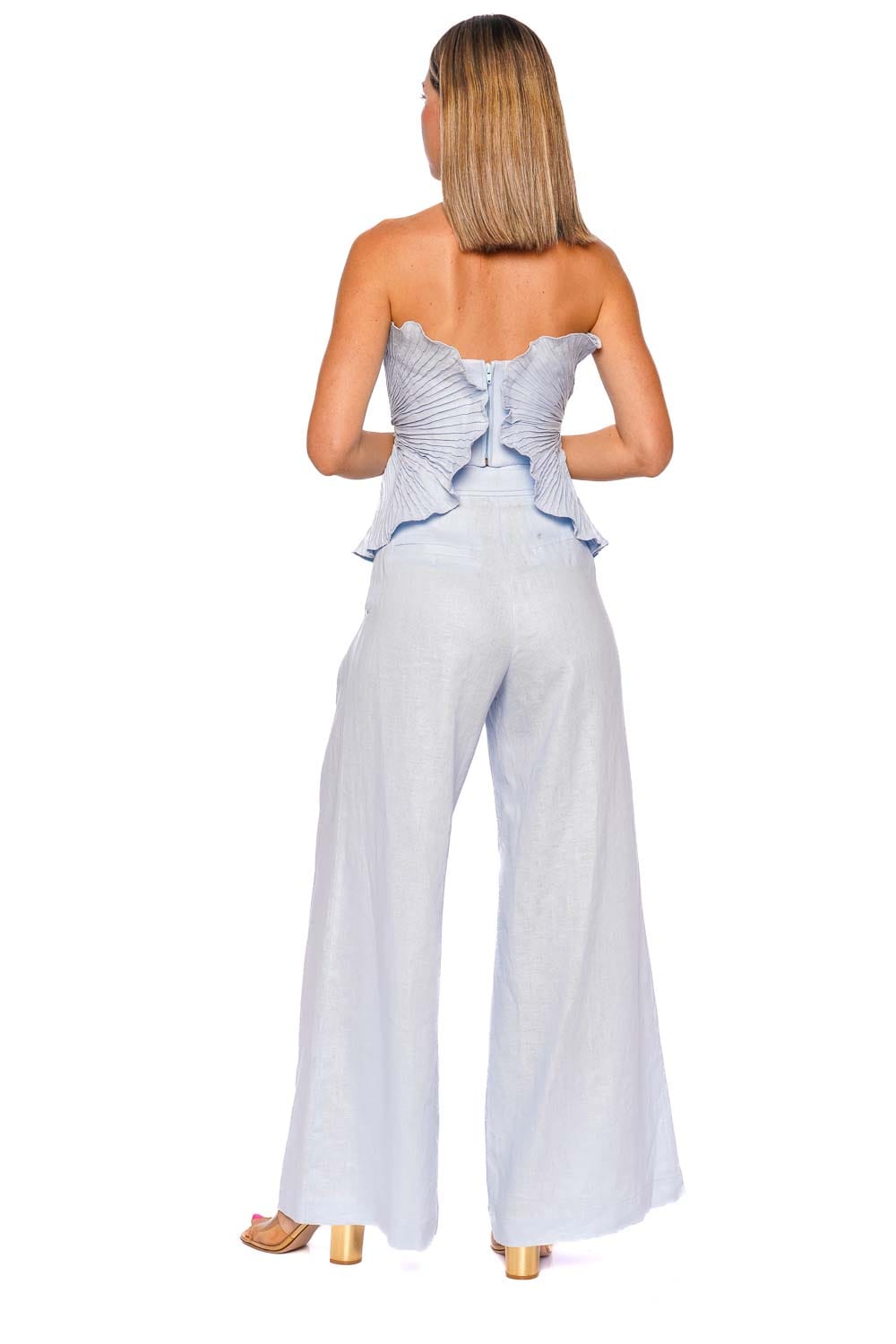 De Tres Pleated Peplum Strapless Top